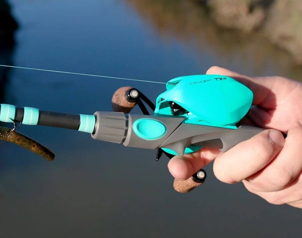 hand holding a green fishing rod